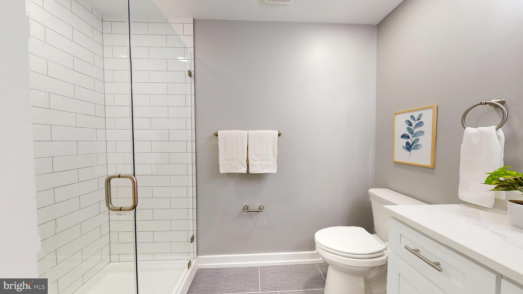 2519 East Fairmount Avenue Baltimore, MD 21224 - Photo 17 of 25 a bathroom with a toilet sink and shower