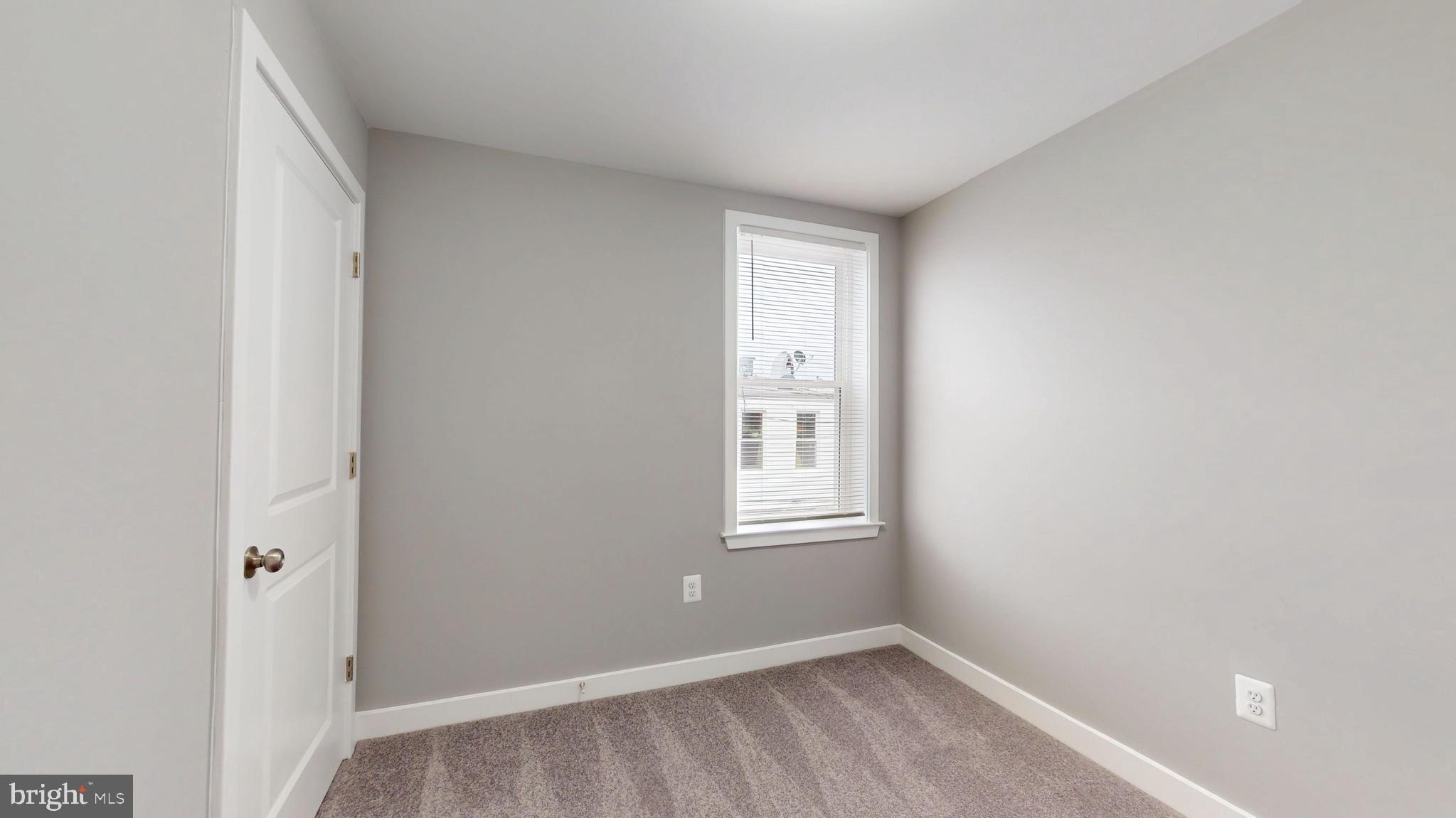 2519 East Fairmount Avenue Baltimore, MD 21224 - Photo 18 of 25 an empty room with windows