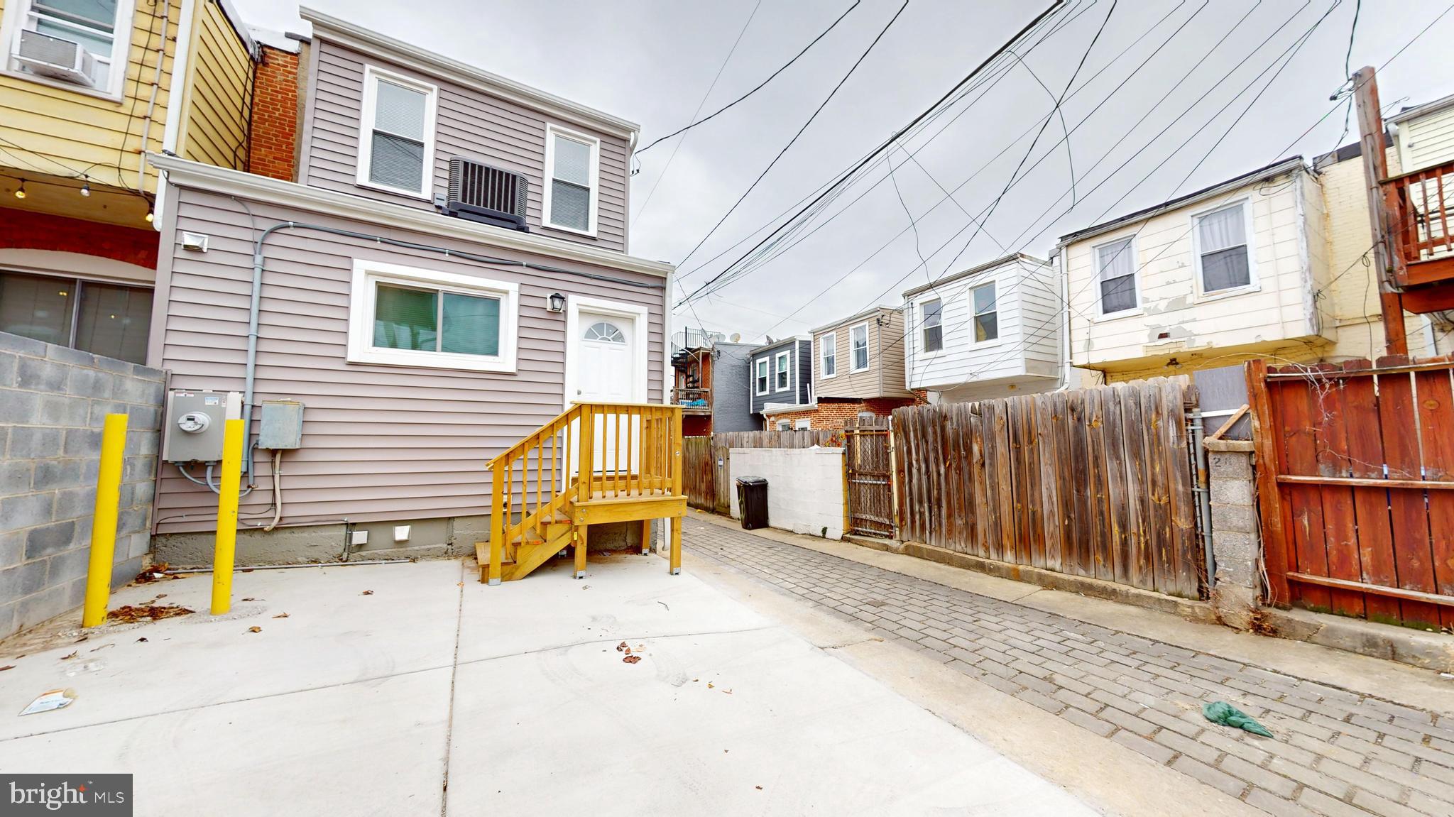 2519 East Fairmount Avenue Baltimore, MD 21224 - Photo 2 of 25 a view of a house with wooden fence