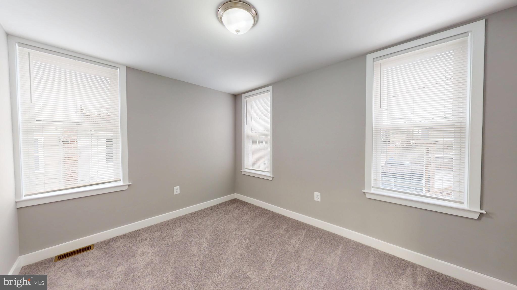 2519 East Fairmount Avenue Baltimore, MD 21224 - Photo 21 of 25 an empty room with windows