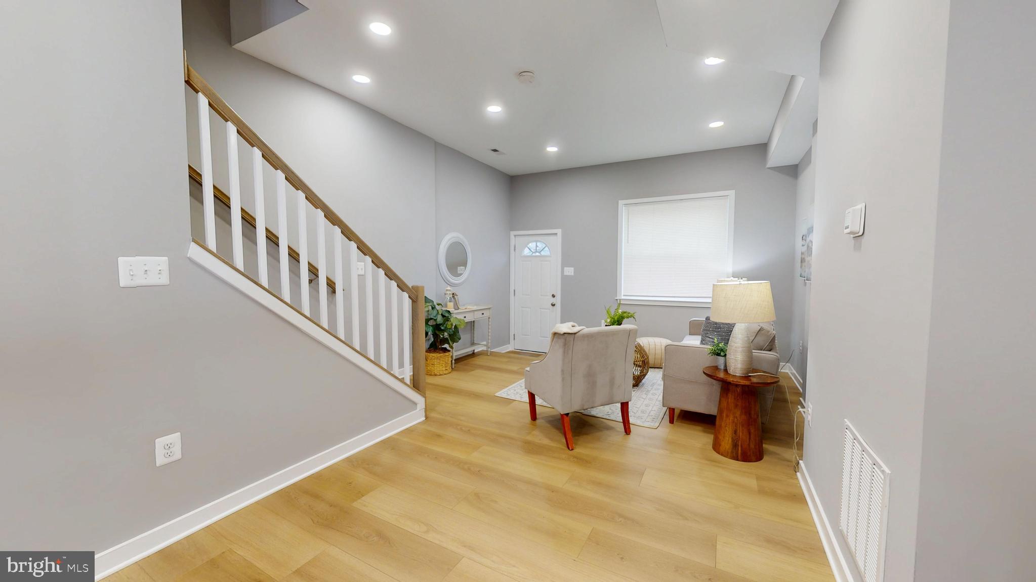 2519 East Fairmount Avenue Baltimore, MD 21224 - Photo 4 of 25 a living room with furniture and a rug