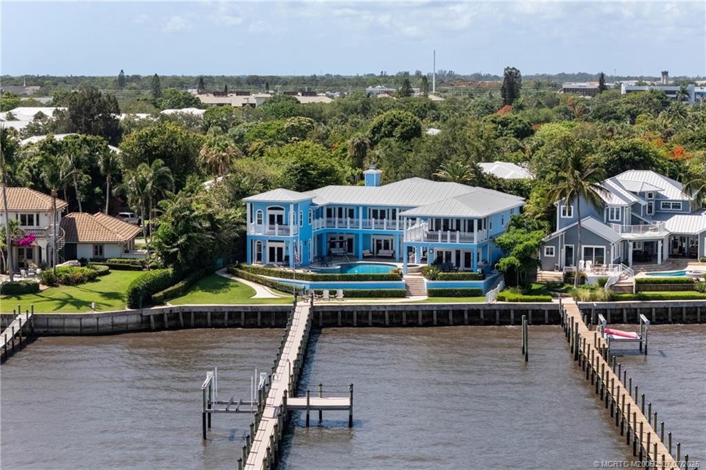 2051 Southeast Riverside Drive Stuart, FL 34996 - Photo 33 of 35 an aerial view of a house with a garden and lake view
