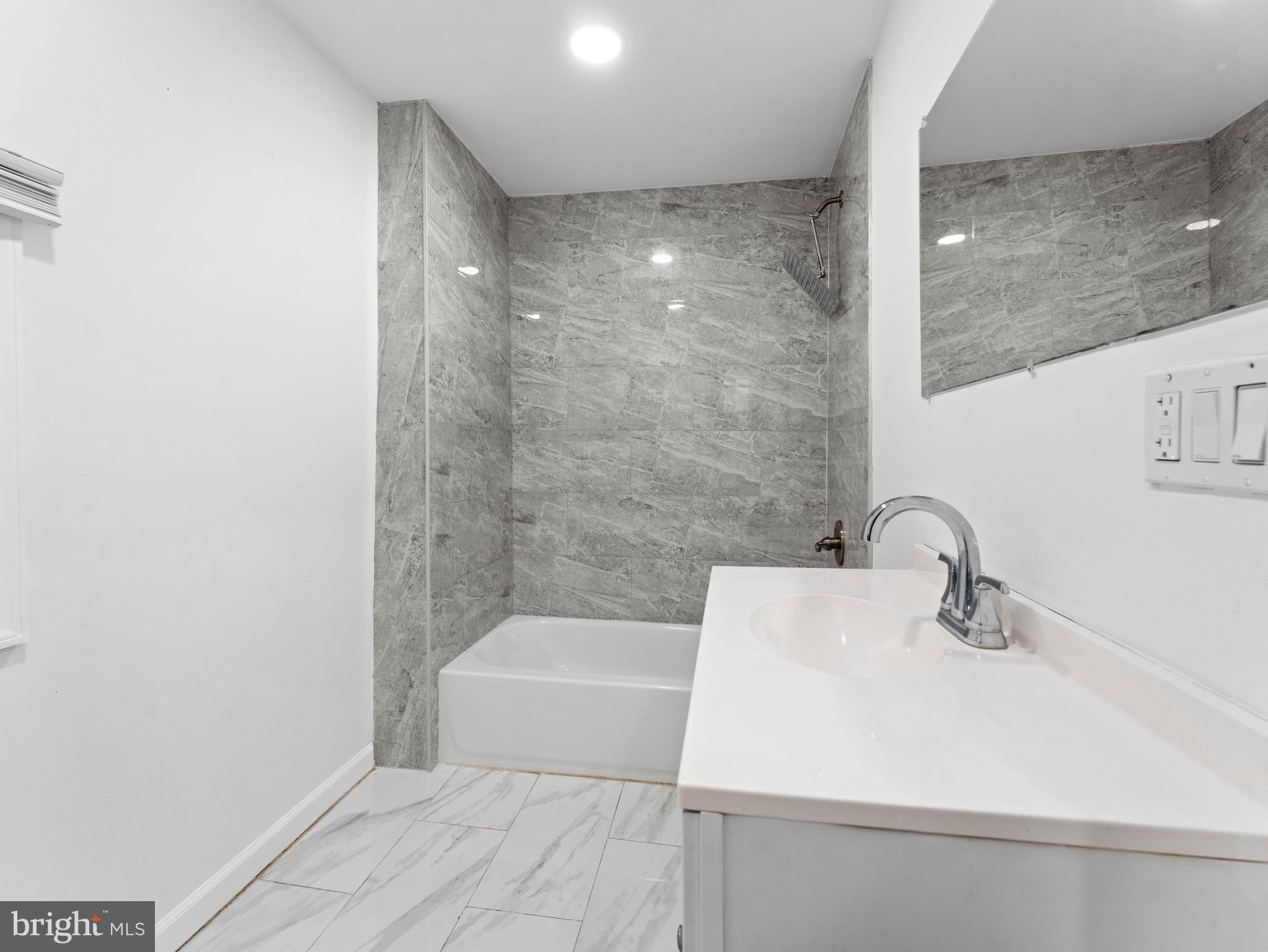 2443 Nicholas Street Philadelphia, PA 19121 - Photo 12 of 27 a bathroom with a sink a toilet and shower