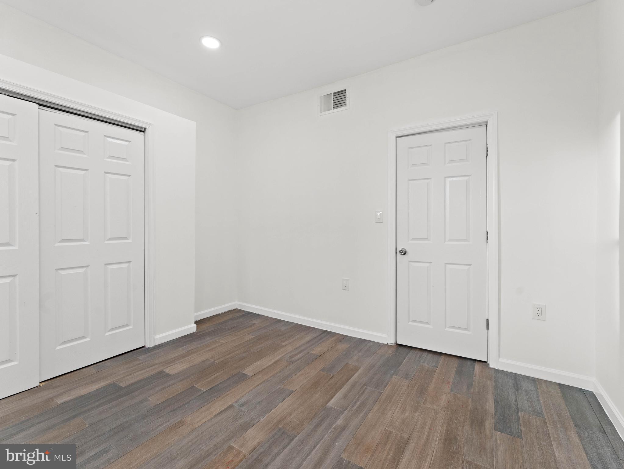 2443 Nicholas Street Philadelphia, PA 19121 - Photo 15 of 27 a view of an empty room with wooden floor