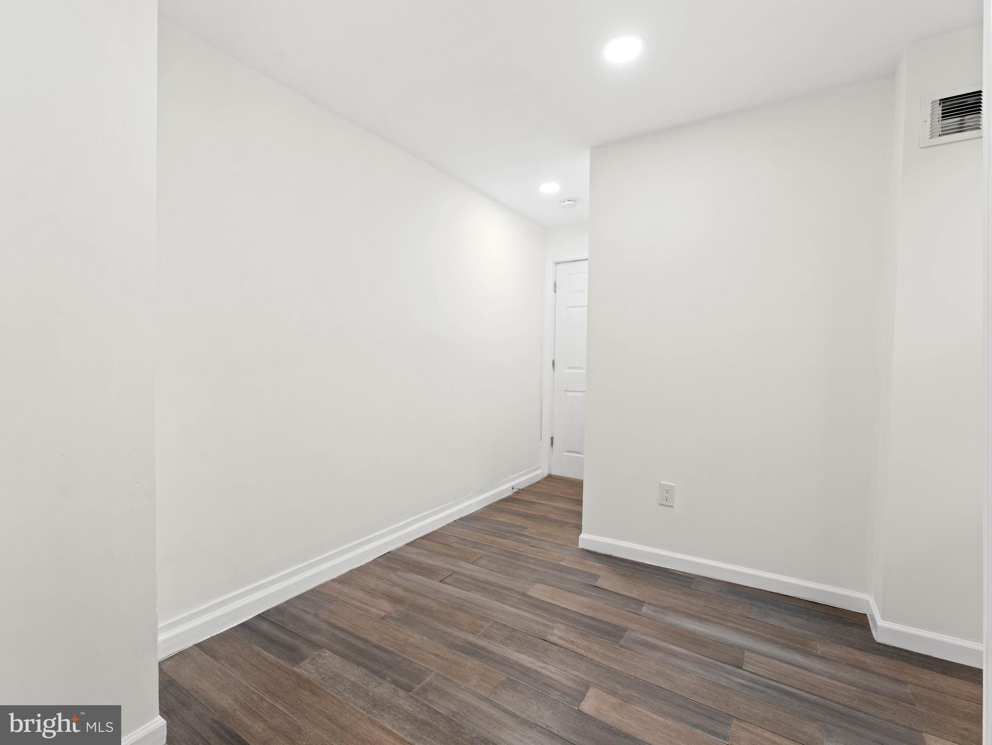 2443 Nicholas Street Philadelphia, PA 19121 - Photo 18 of 27 a view of an empty room with wooden floor