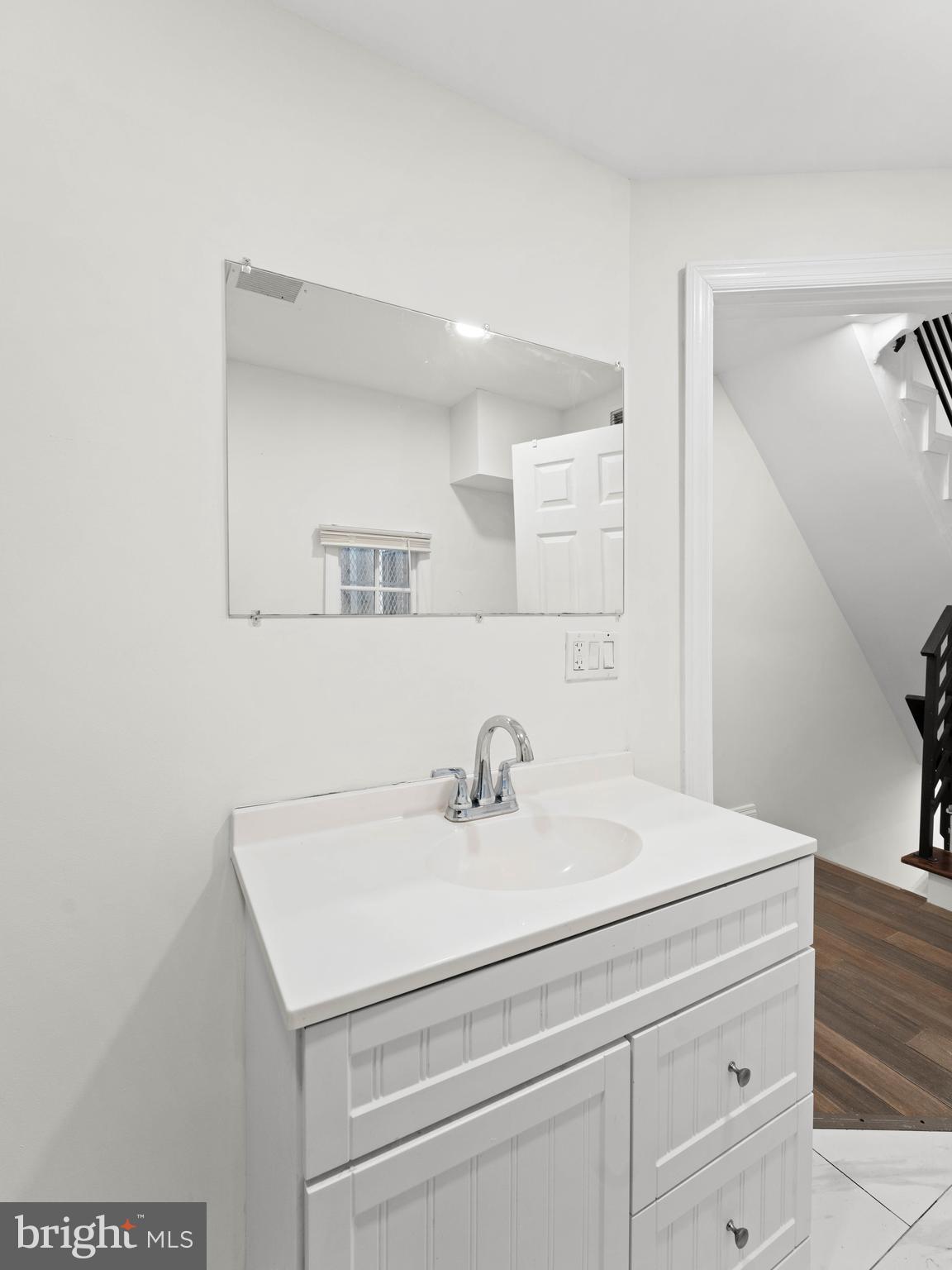 2443 Nicholas Street Philadelphia, PA 19121 - Photo 19 of 27 a bathroom with a sink and a mirror