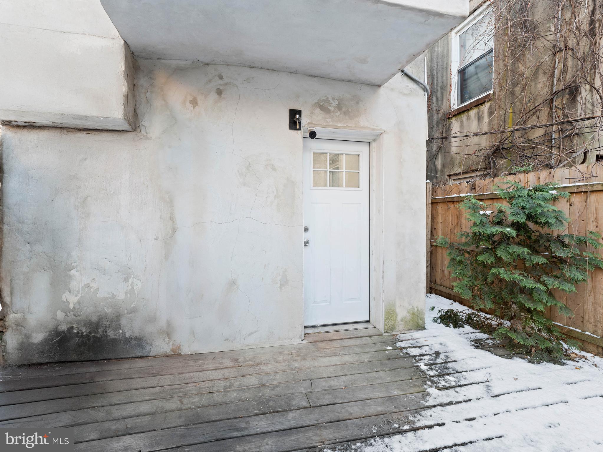 2443 Nicholas Street Philadelphia, PA 19121 - Photo 26 of 27 a view of a front door and wooden floor