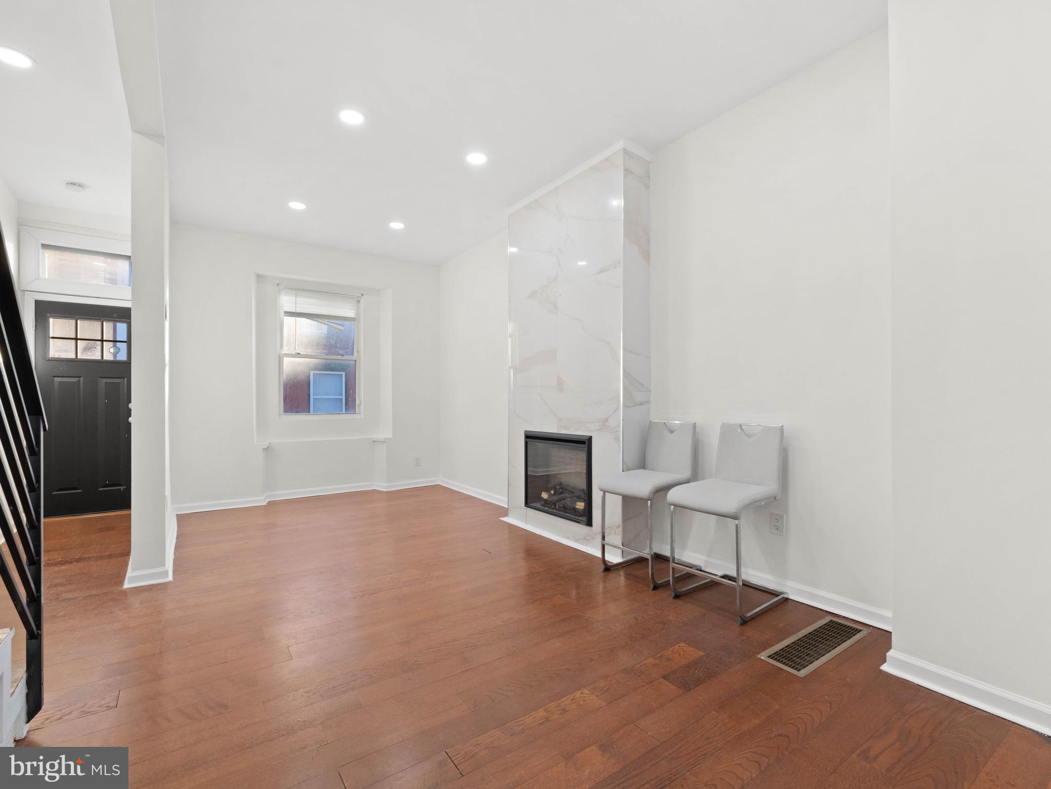 2443 Nicholas Street Philadelphia, PA 19121 - Photo 4 of 27 a view of livingroom with furniture and fireplace