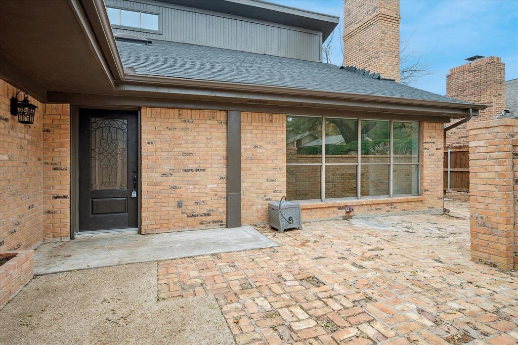 62 Legend Road Benbrook, TX 76132 - Photo 2 of 27 Enjoy morning coffee in this private brick front courtyard.