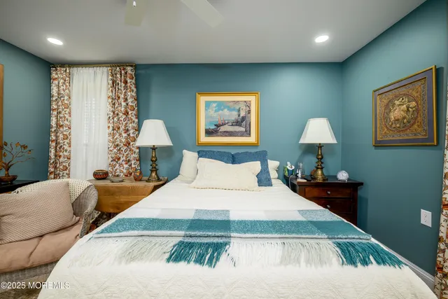 a bedroom with a large bed and a couch