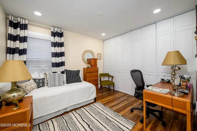 a living room with furniture and a lamp