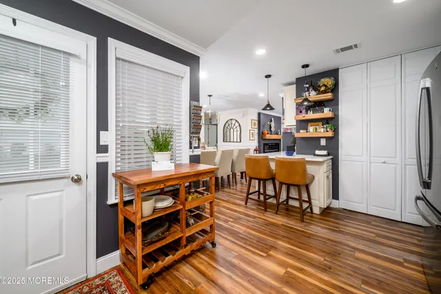 a living room with furniture a rug and a window