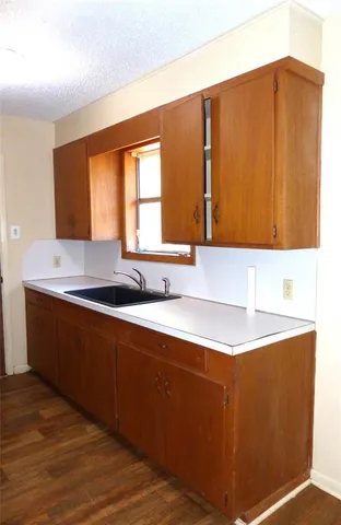 a kitchen with a sink and a window