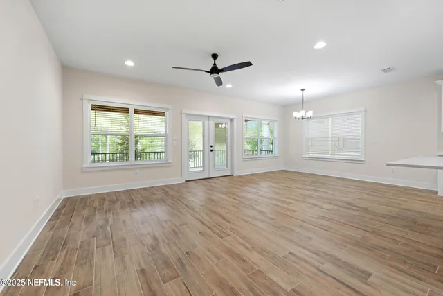 a bedroom with bed and window
