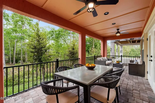 a bathroom with a double vanity sink a mirror and a toilet