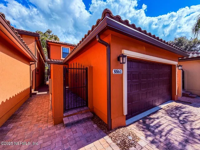a large kitchen with kitchen island a sink stainless steel appliances and cabinets
