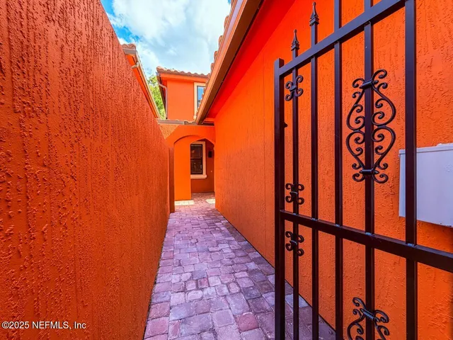 a kitchen with kitchen island a sink stainless steel appliances and cabinets
