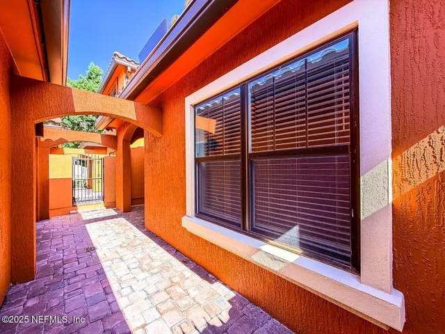 a large kitchen with stainless steel appliances lots of counter space and wooden floor