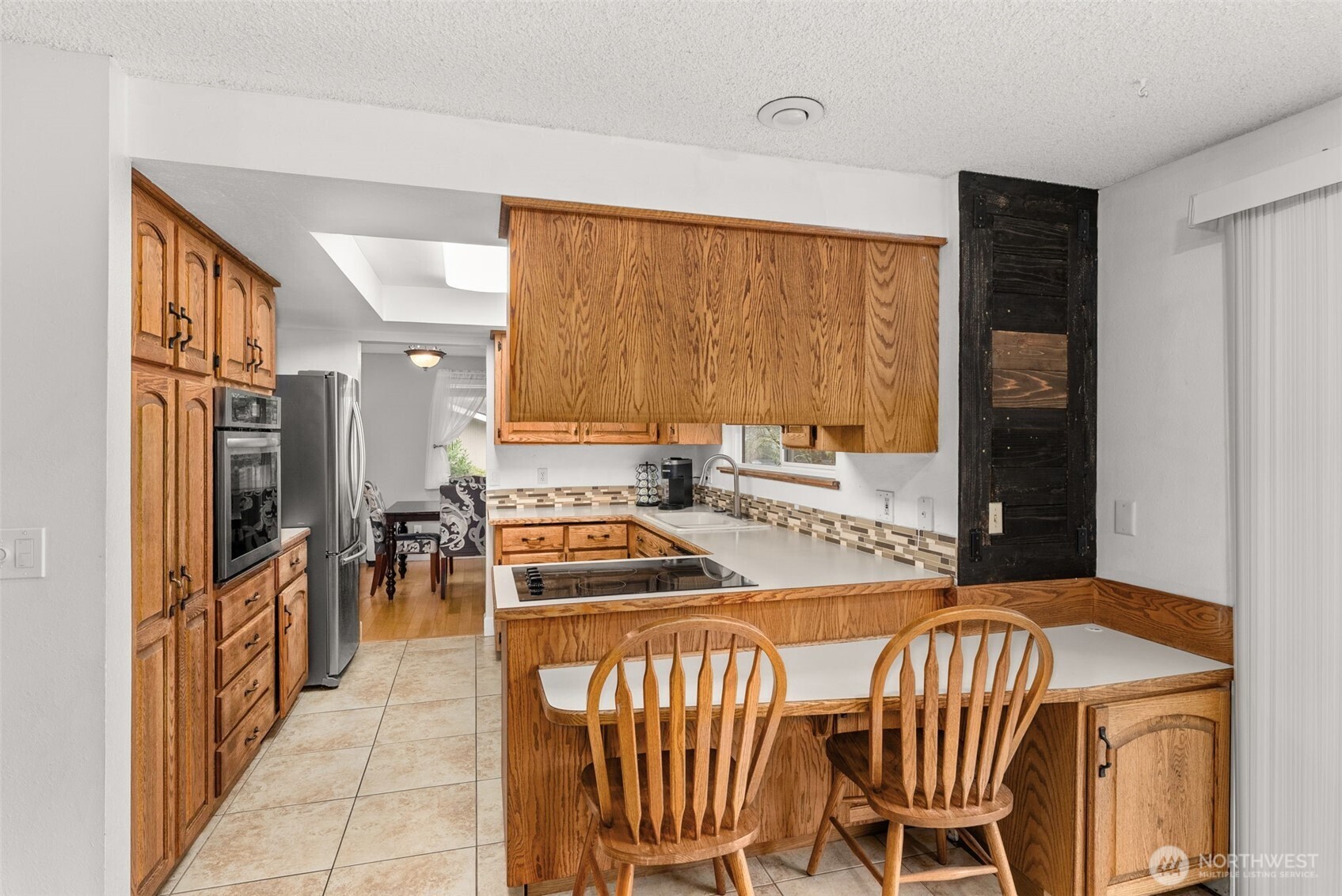 360 Byrd Street Centralia, WA 98531 - Photo 12 of 38 a kitchen with a table chairs stove and refrigerator