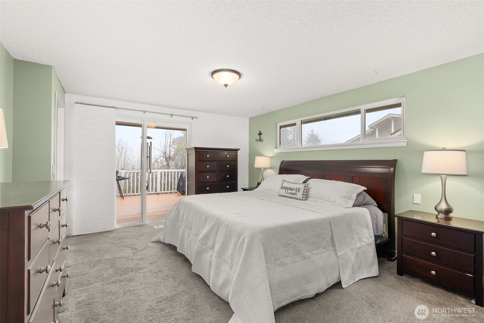 360 Byrd Street Centralia, WA 98531 - Photo 19 of 38 a bedroom with a large bed and a wooden floor