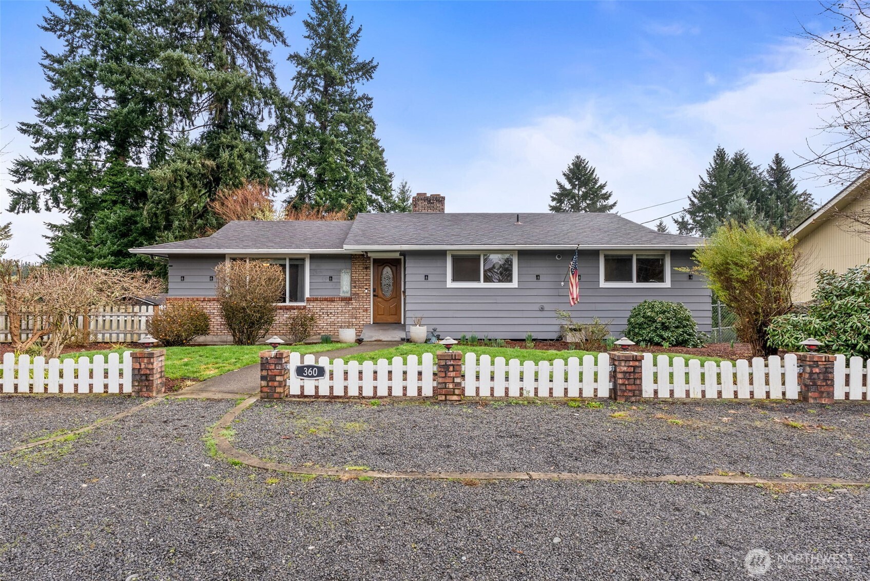 360 Byrd Street Centralia, WA 98531 - Photo 2 of 38 a front view of a house with a garden