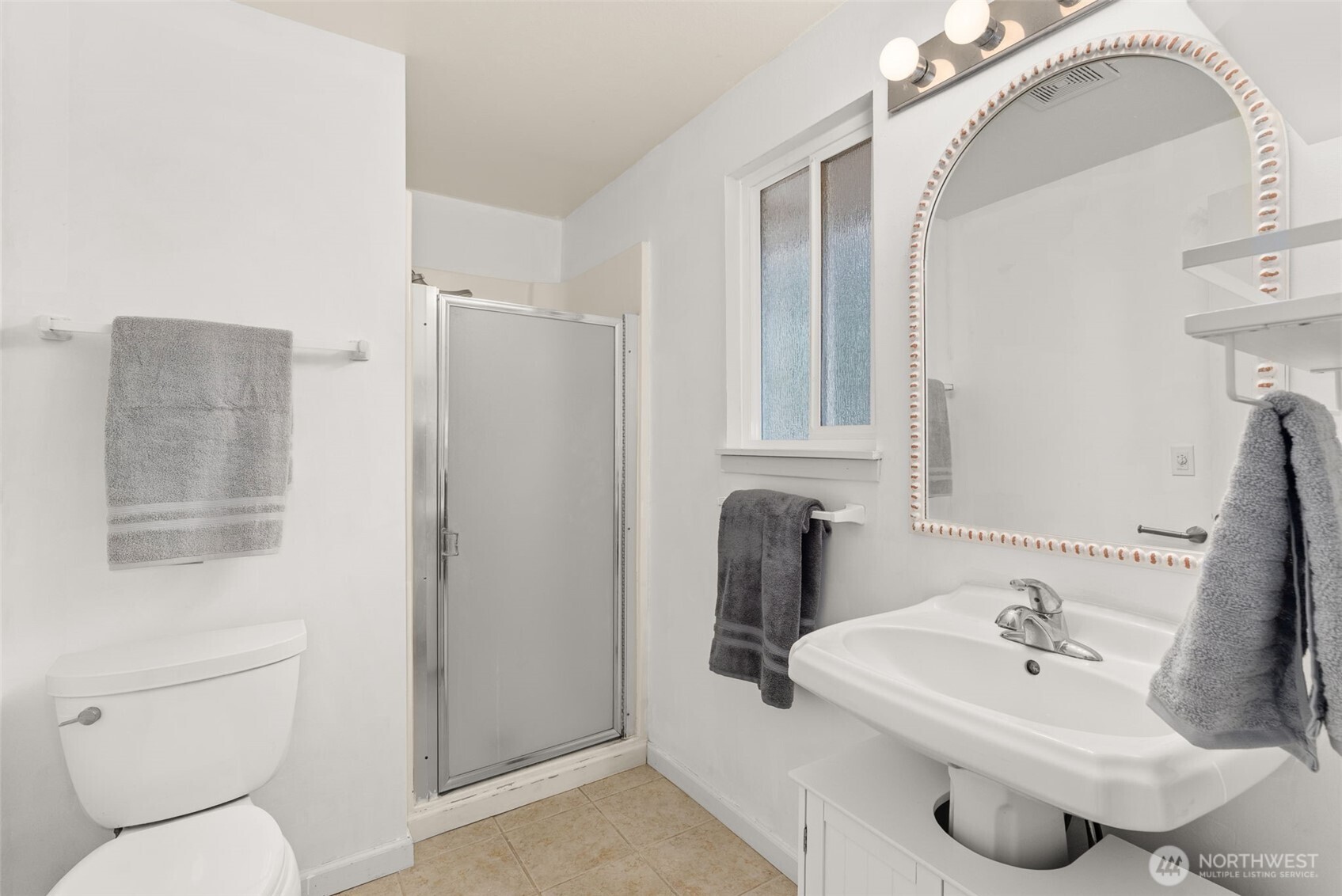 360 Byrd Street Centralia, WA 98531 - Photo 21 of 38 a bathroom with a sink toilet and mirror