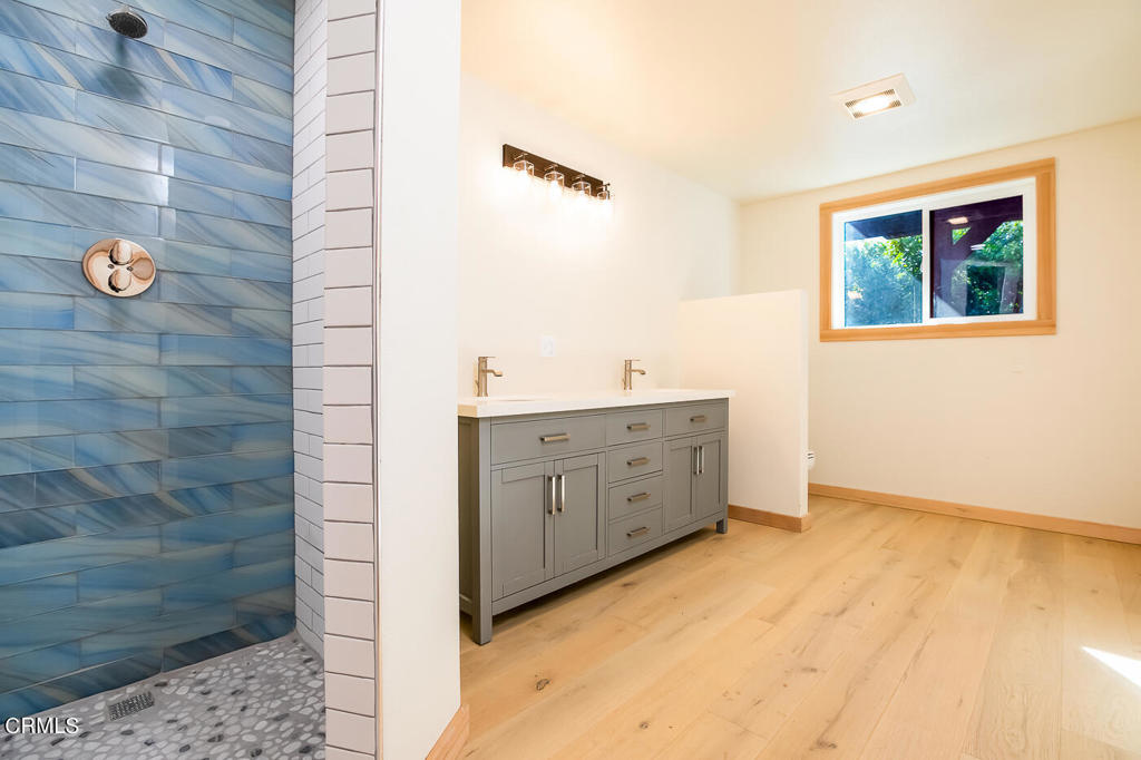45460 Indian Shoals Road Mendocino, CA 95460 - Photo 36 of 50 a bathroom with a double vanity sink and mirror