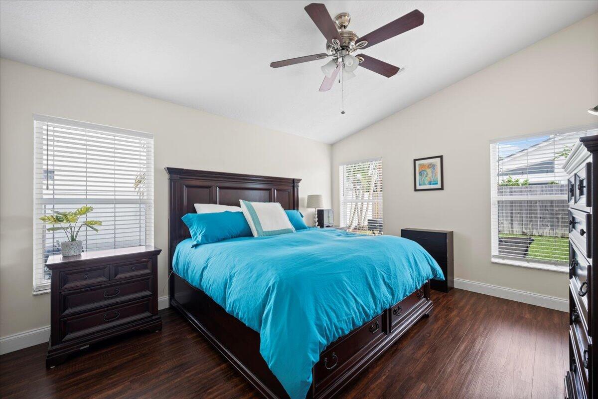 6377 Barbara Street Jupiter, FL 33458 - Photo 15 of 23 a bedroom with a large bed and a window