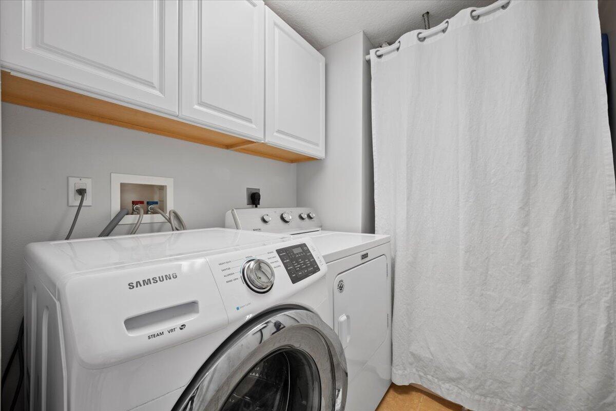6377 Barbara Street Jupiter, FL 33458 - Photo 21 of 23 a utility room with dryer and washer