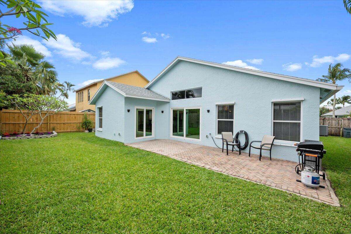 6377 Barbara Street Jupiter, FL 33458 - Photo 4 of 23 a view of a house with backyard and sitting area