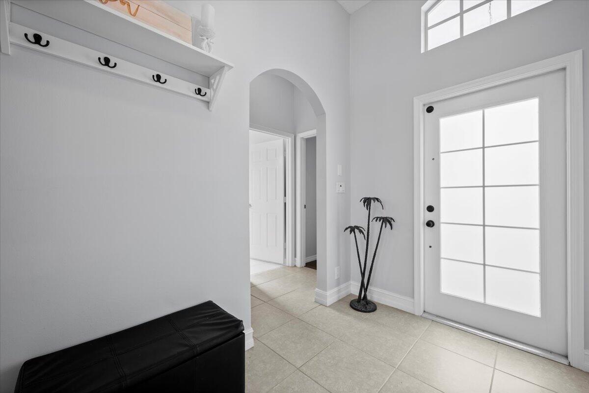 6377 Barbara Street Jupiter, FL 33458 - Photo 9 of 23 a view of entryway with a rug