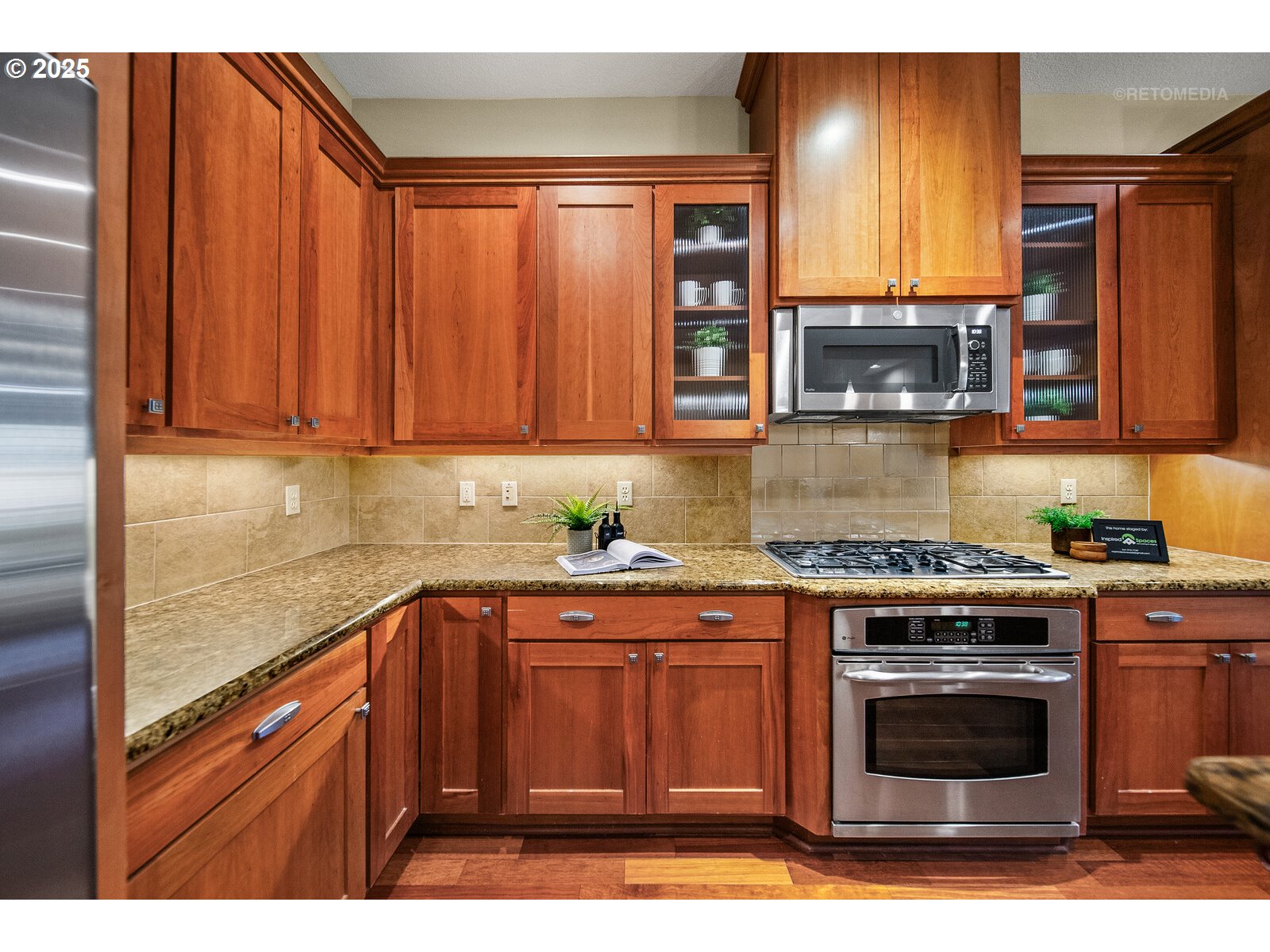 10225 Southwest Taylor Street Portland, OR 97225 - Photo 6 of 43 a kitchen with stainless steel appliances granite countertop a stove a sink and a microwave
