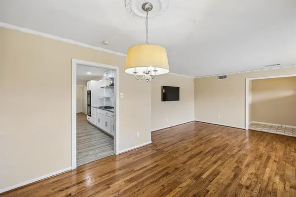 a view of a livingroom with wooden floor
