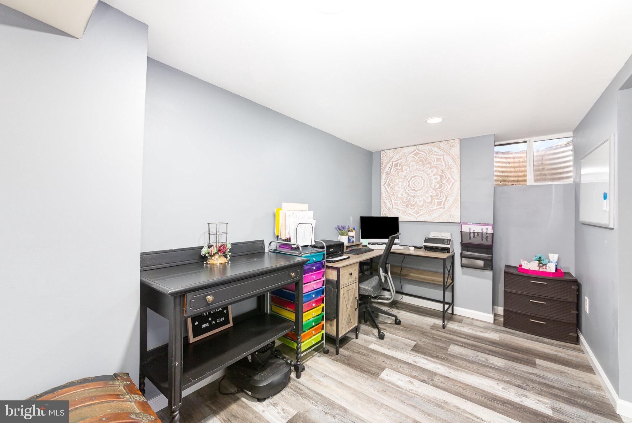 4116 Kahlston Road Baltimore, MD 21236 - Photo 24 of 37 a view of a workspace with furniture and a window