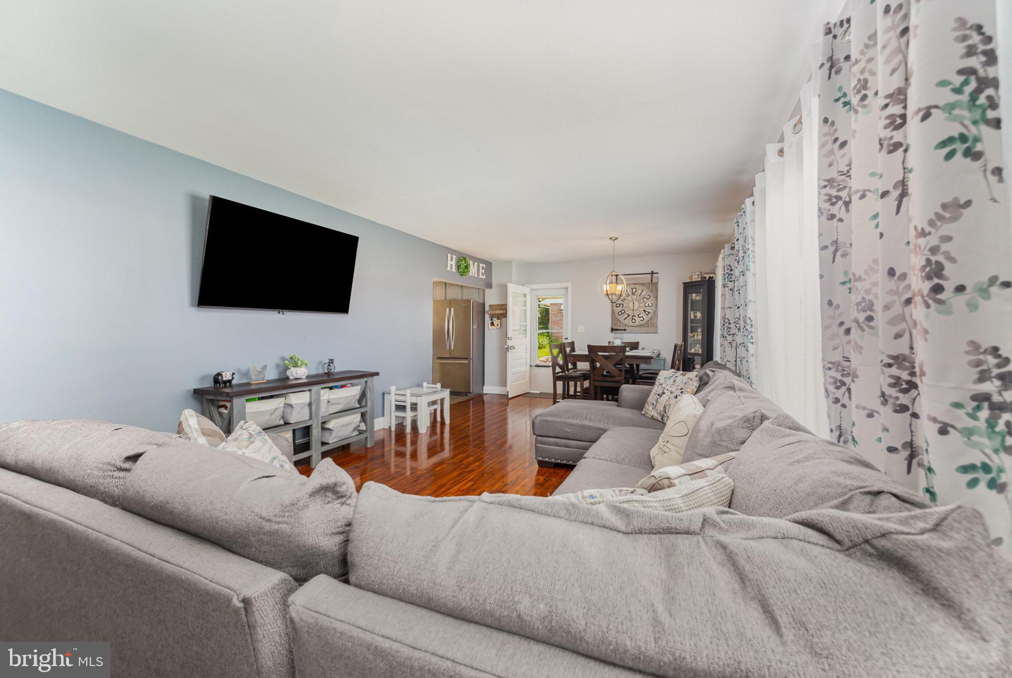 4116 Kahlston Road Baltimore, MD 21236 - Photo 7 of 37 a living room with furniture and a flat screen tv