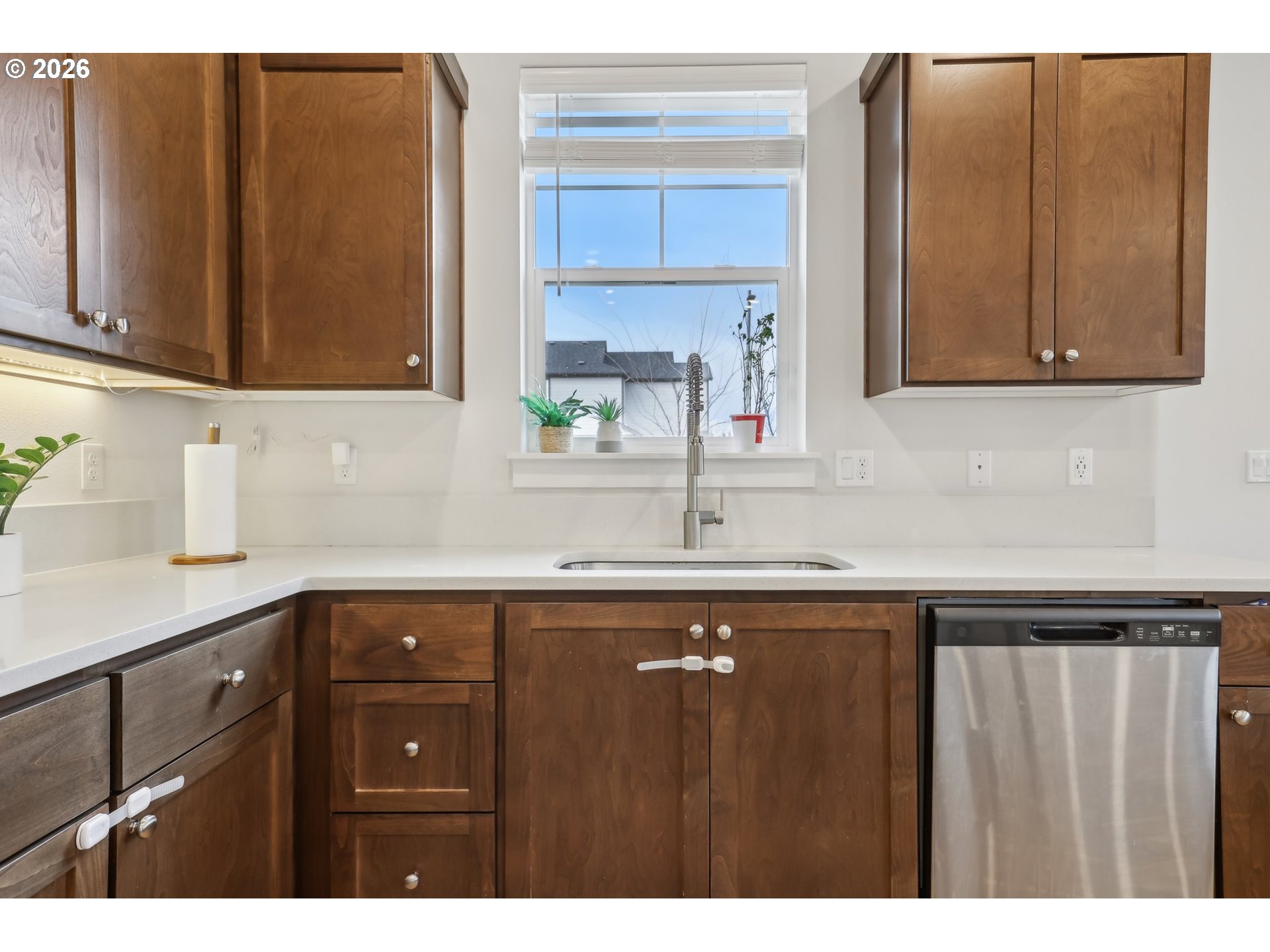 18436 Southwest Buckhorn Drive Beaverton, OR 97007 - Photo 13 of 35 a kitchen with a sink a window and cabinets