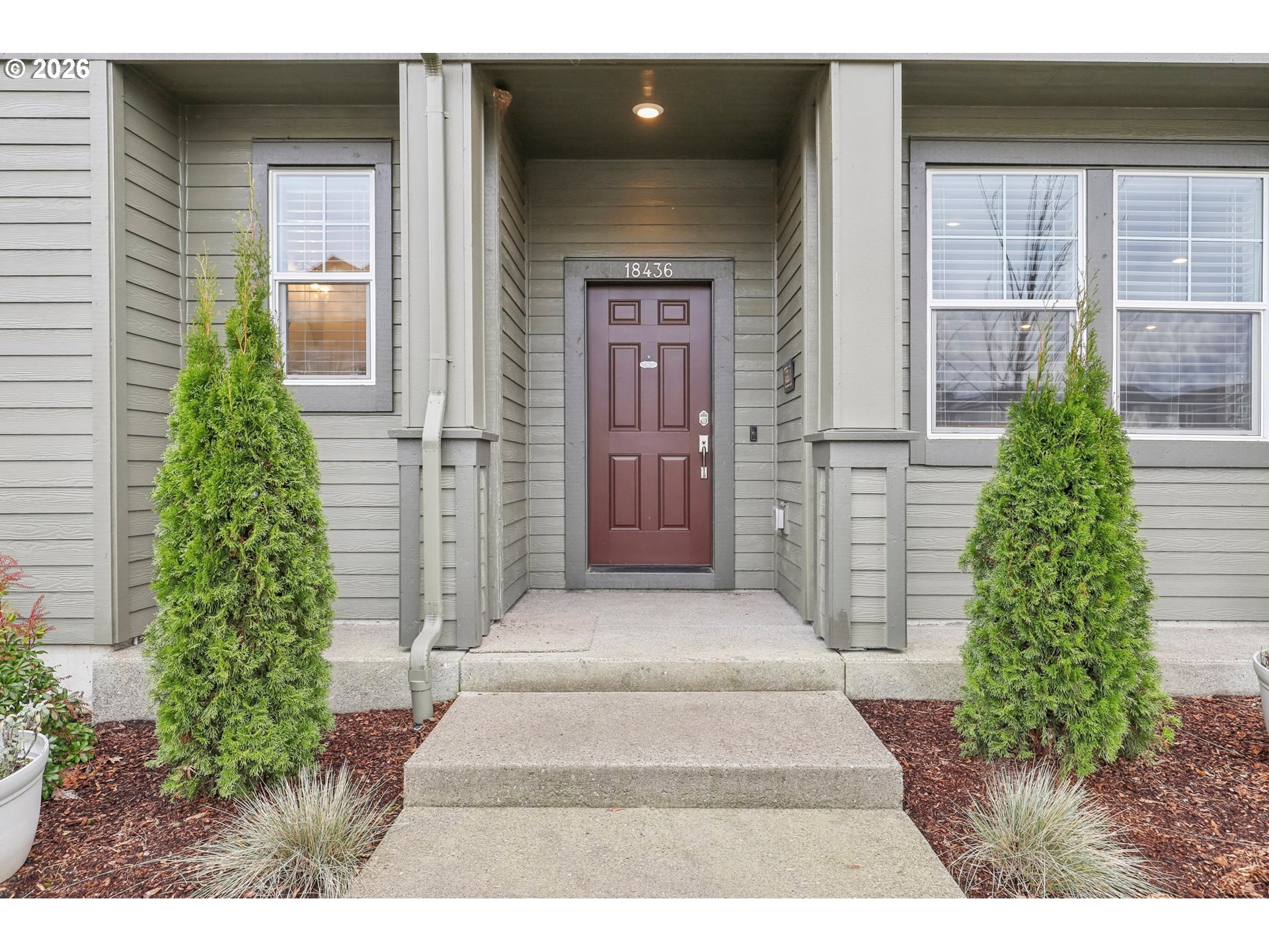 18436 Southwest Buckhorn Drive Beaverton, OR 97007 - Photo 2 of 35 a front view of a house with a garden