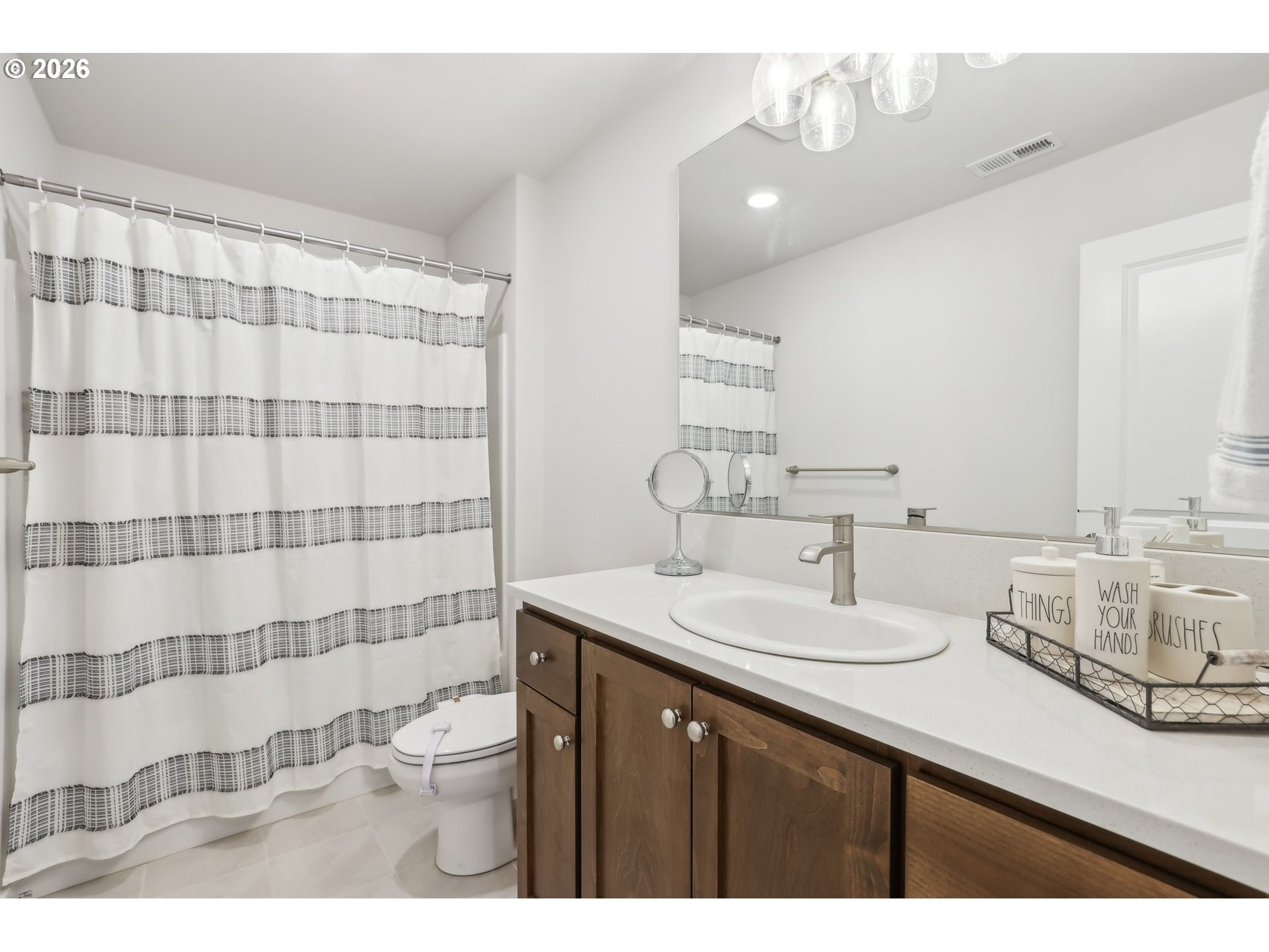 18436 Southwest Buckhorn Drive Beaverton, OR 97007 - Photo 23 of 35 a bathroom with a sink a toilet and shower curtain