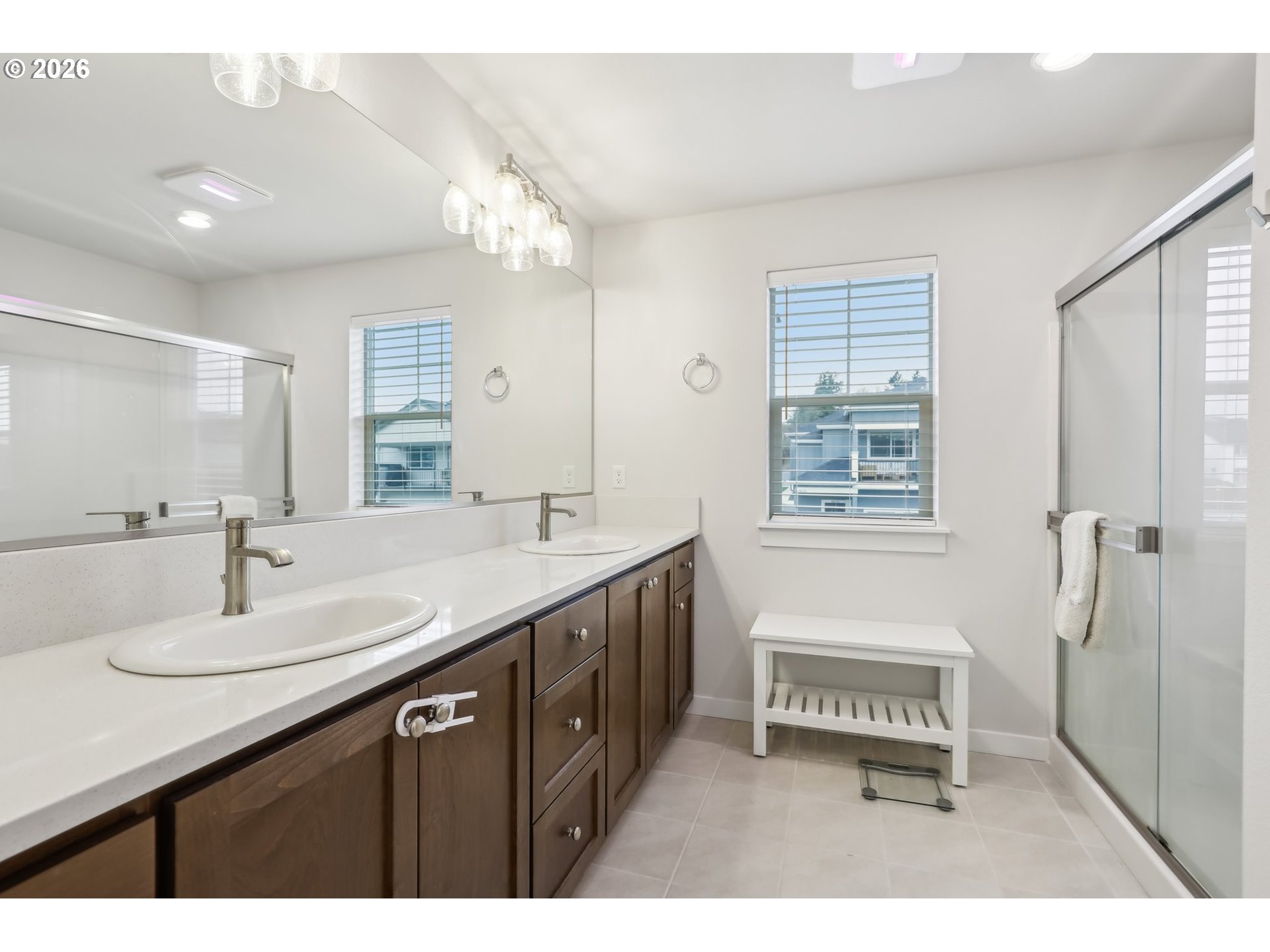18436 Southwest Buckhorn Drive Beaverton, OR 97007 - Photo 31 of 35 a bathroom with a sink double vanity granite tub and a mirror