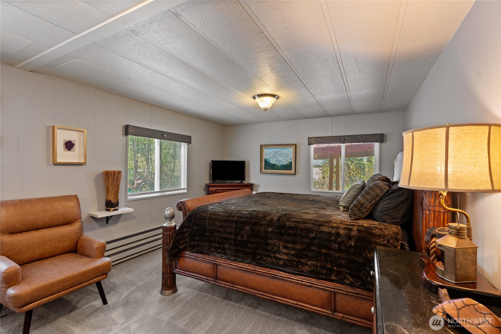 271 Skate Creek Road North Ashford, WA 98304 - Photo 12 of 40 a bedroom with a bed couch and window