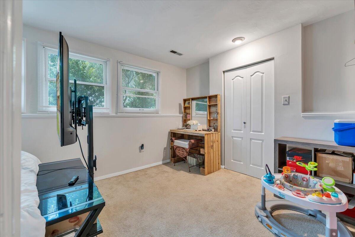 7851 Cedar Edge Road Roanoke, VA 24018 - Photo 27 of 44 a room with furniture a window and gym equipment