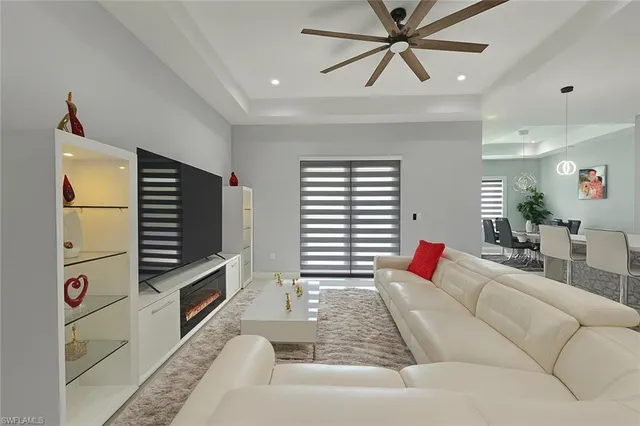 a living room with furniture and flat screen tv