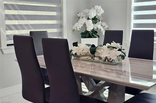 a kitchen with a refrigerator and a stove