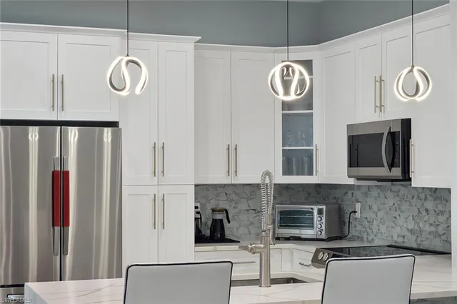 a bedroom with a bed and a large mirror