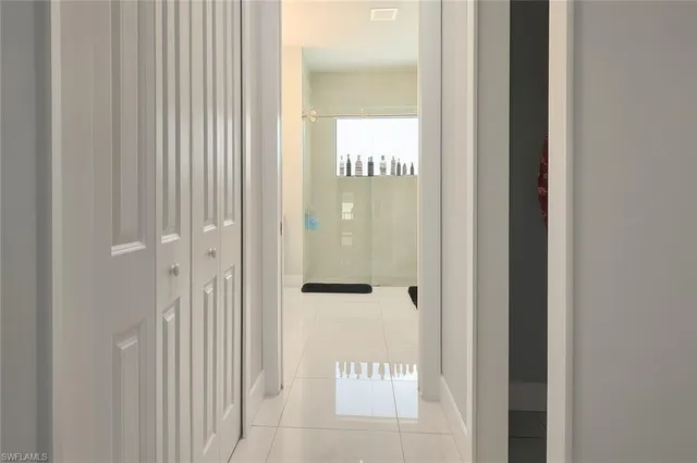 a bathroom with a sink a toilet a shower and a mirror