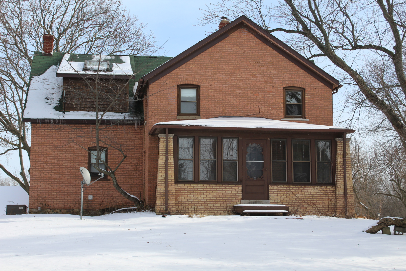 1245 Main Street Antioch, IL 60002 - Photo 2 of 44 a front view of a house with a garage