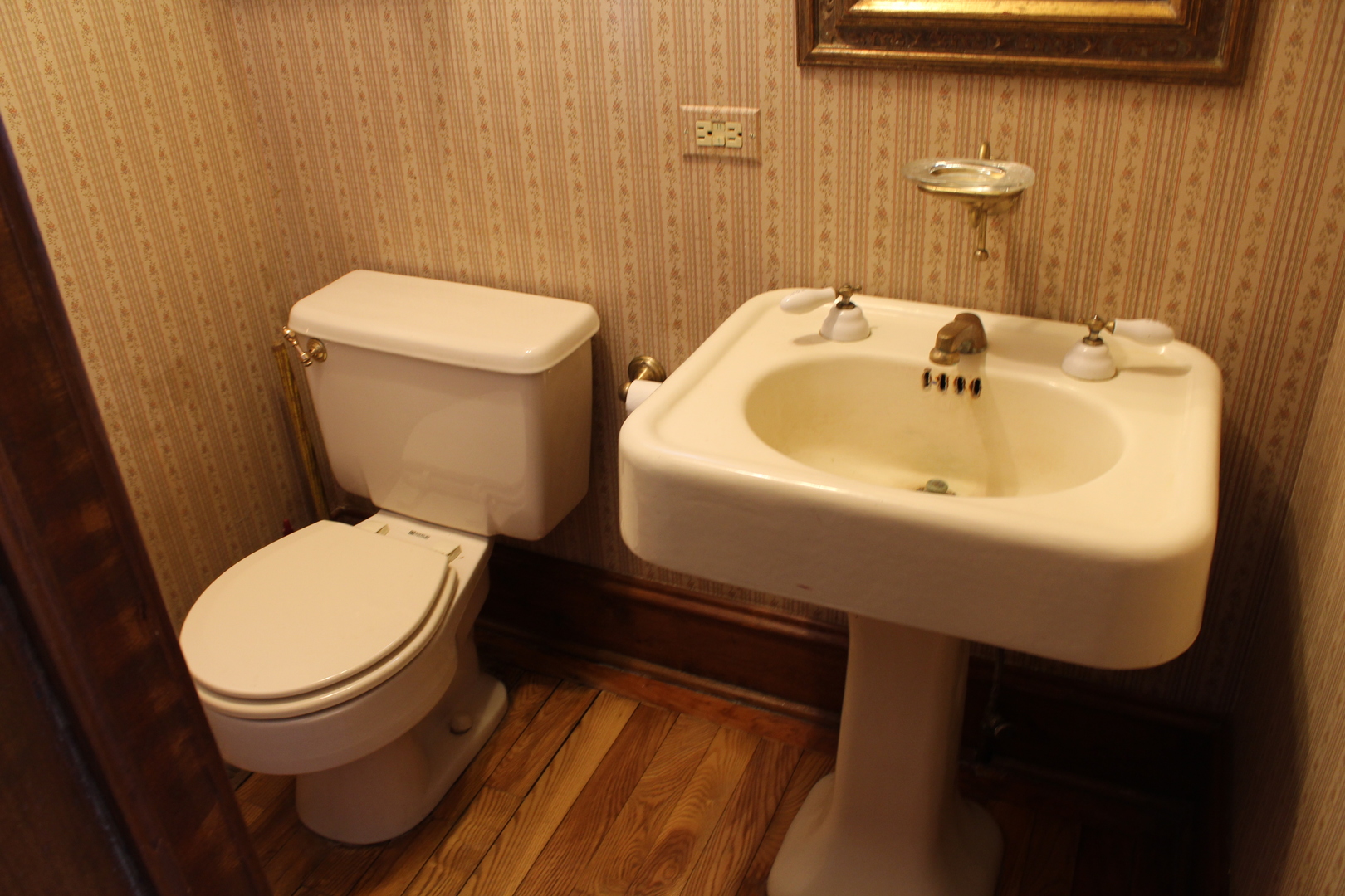 1245 Main Street Antioch, IL 60002 - Photo 11 of 44 a white toilet sitting next to a bathroom sink