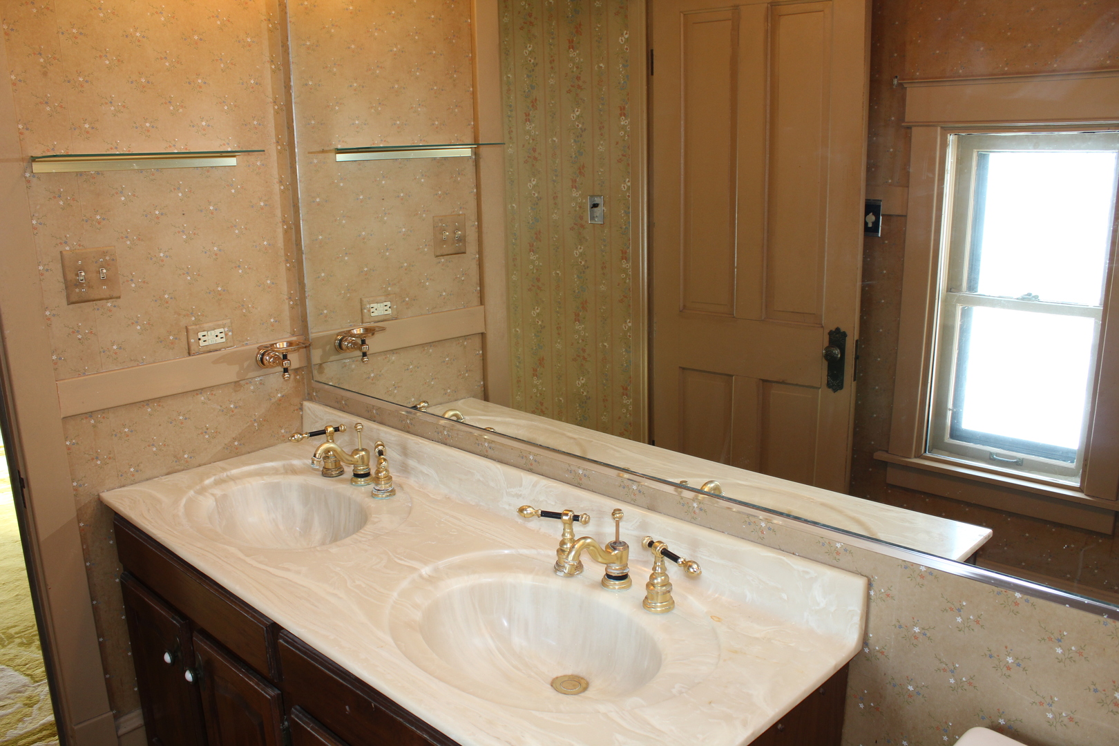 1245 Main Street Antioch, IL 60002 - Photo 29 of 44 a bathroom with a sink and a large mirror