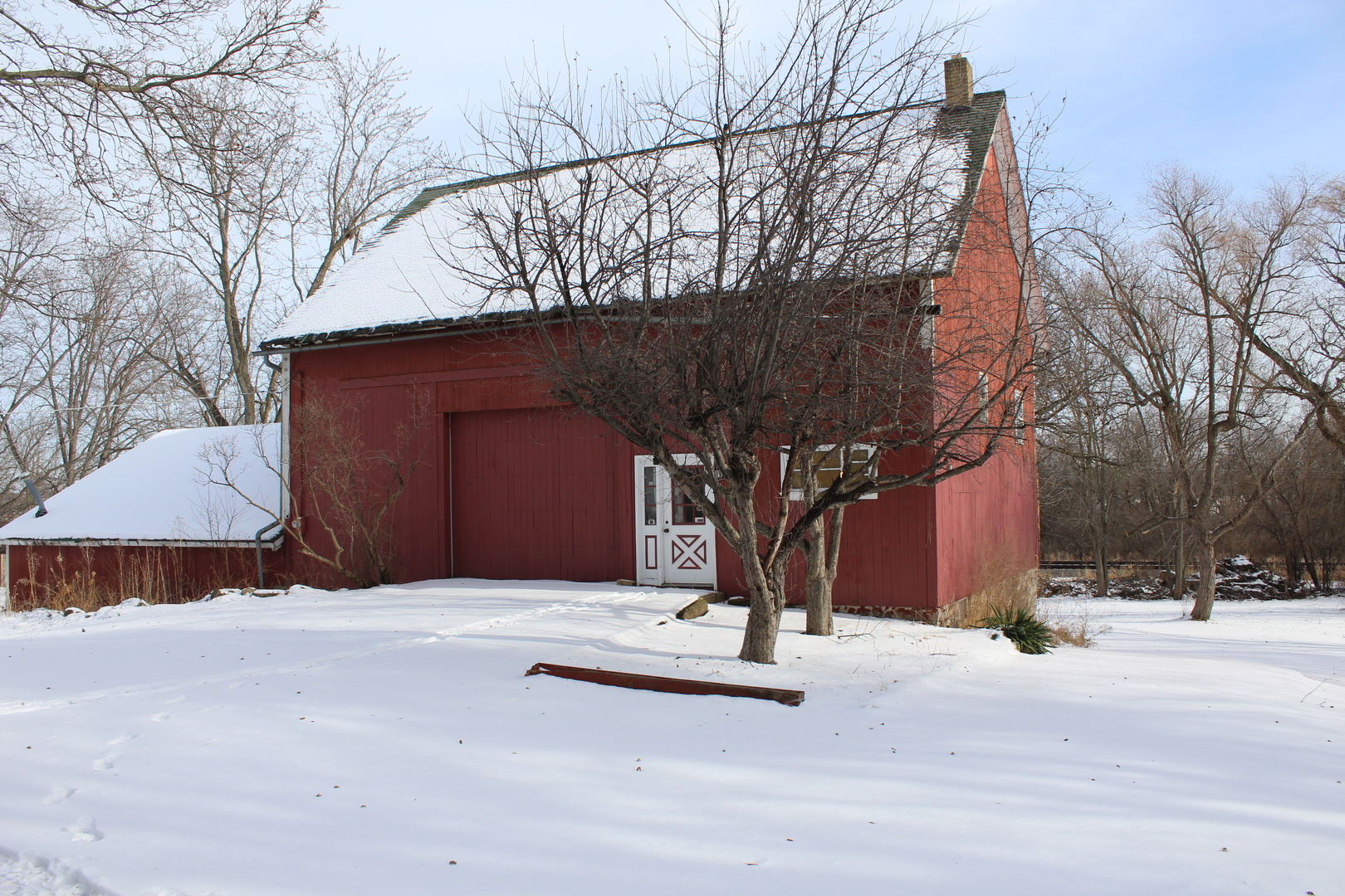 1245 Main Street Antioch, IL 60002 - Photo 33 of 44 a wooden bench sitting in front of a building