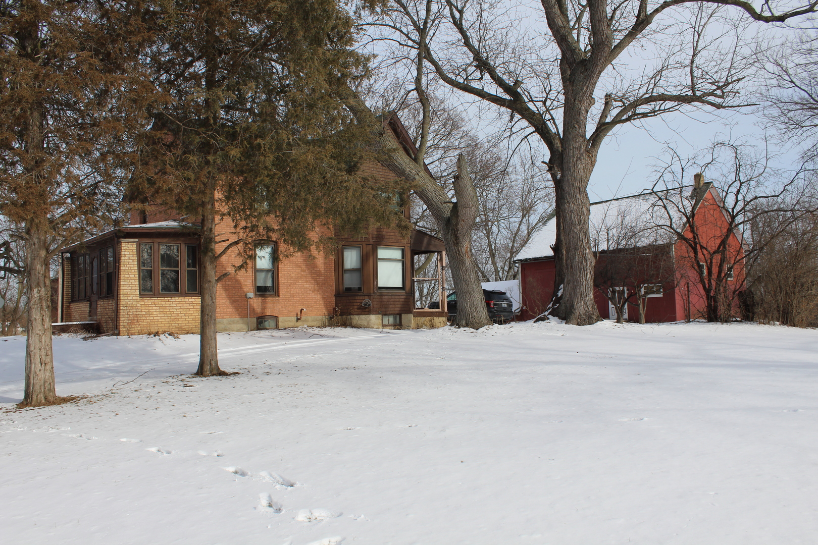 1245 Main Street Antioch, IL 60002 - Photo 36 of 44 a street view of a house with a snow